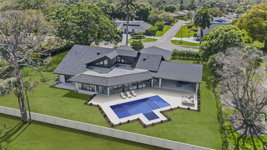 Please do not walk property without a confirmed appointment!  Introducing one of the most extraordinary residences ever offered in Eastpointe Country Club. Perfectly positioned on over half an acre along the 10th hole of the East Course, this remarkable estate represents a true trophy property within one of Palm Beach County's premier private golf communities.  Spanning over 3,700 square feet of refined living space, this impressive residence features 4 bedrooms, 3 full bathrooms, and 2 half baths, all thoughtfully designed around soaring ceilings and an open, light-filled floor plan that seamlessly blends elegant interior living with exceptional outdoor entertaining.  At the heart of the home... expansive living areas flow effortlessly to a spectacular newly constructed 960-square-foot outdoor lounge, creating a private resort-style setting rarely found in Eastpointe. The outdoor entertainment pavilion is nothing short of extraordinary, featuring an expansive bar, imported Italian pizza oven, three additional grilling stations, sink, icemaker, dishwasher, warming trays, and every amenity needed to host unforgettable gatherings. A drop-down outdoor screen allows guests to enjoy movies or the big game poolside, while a dedicated cabana bath enhances comfort and convenience.  The interior of the home is equally impressive, enhanced with fully integrated smart-home technology controlling interior and exterior lighting, whole-home music, climate systems, garage doors, and a dramatic 150-inch drop-down theater screen in the living room—bringing modern luxury and convenience to everyday living.  Additional highlights include:  All hurricane-impact windows and doors  Brand new 2024 roof  2½-car garage with hurricane-impact garage doors  Expansive golf course views from one of the largest homesites in Eastpointe  Further elevating the property, the outdoor environment continues to evolve with a nearly 2,000-square-foot pool deck, exterior fencing, and designer fireplace tile currently nearing completion—promising an even more spectacular finished product.  With its rare half-acre setting, commanding golf course frontage, exceptional scale, and world-class entertaining spaces, this home stands among the largest residences on one of the largest and most desirable lots in all of Eastpointe.  An extraordinary opportunity to own a true showpiece property in one of Palm Beach Gardens' most sought-after golf communities.