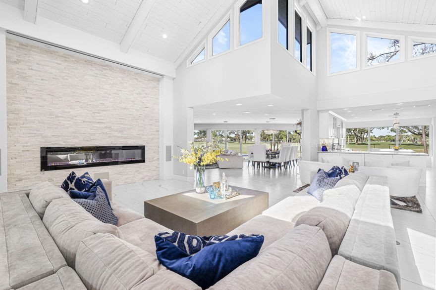 Please do not walk property without a confirmed appointment!  Introducing one of the most extraordinary residences ever offered in Eastpointe Country Club. Perfectly positioned on over half an acre along the 10th hole of the East Course, this remarkable estate represents a true trophy property within one of Palm Beach County's premier private golf communities.  Spanning over 3,700 square feet of refined living space, this impressive residence features 4 bedrooms, 3 full bathrooms, and 2 half baths, all thoughtfully designed around soaring ceilings and an open, light-filled floor plan that seamlessly blends elegant interior living with exceptional outdoor entertaining.  At the heart of the home... expansive living areas flow effortlessly to a spectacular newly constructed 960-square-foot outdoor lounge, creating a private resort-style setting rarely found in Eastpointe. The outdoor entertainment pavilion is nothing short of extraordinary, featuring an expansive bar, imported Italian pizza oven, three additional grilling stations, sink, icemaker, dishwasher, warming trays, and every amenity needed to host unforgettable gatherings. A drop-down outdoor screen allows guests to enjoy movies or the big game poolside, while a dedicated cabana bath enhances comfort and convenience.  The interior of the home is equally impressive, enhanced with fully integrated smart-home technology controlling interior and exterior lighting, whole-home music, climate systems, garage doors, and a dramatic 150-inch drop-down theater screen in the living room—bringing modern luxury and convenience to everyday living.  Additional highlights include:  All hurricane-impact windows and doors  Brand new 2024 roof  2½-car garage with hurricane-impact garage doors  Expansive golf course views from one of the largest homesites in Eastpointe  Further elevating the property, the outdoor environment continues to evolve with a nearly 2,000-square-foot pool deck, exterior fencing, and designer fireplace tile currently nearing completion—promising an even more spectacular finished product.  With its rare half-acre setting, commanding golf course frontage, exceptional scale, and world-class entertaining spaces, this home stands among the largest residences on one of the largest and most desirable lots in all of Eastpointe.  An extraordinary opportunity to own a true showpiece property in one of Palm Beach Gardens' most sought-after golf communities.