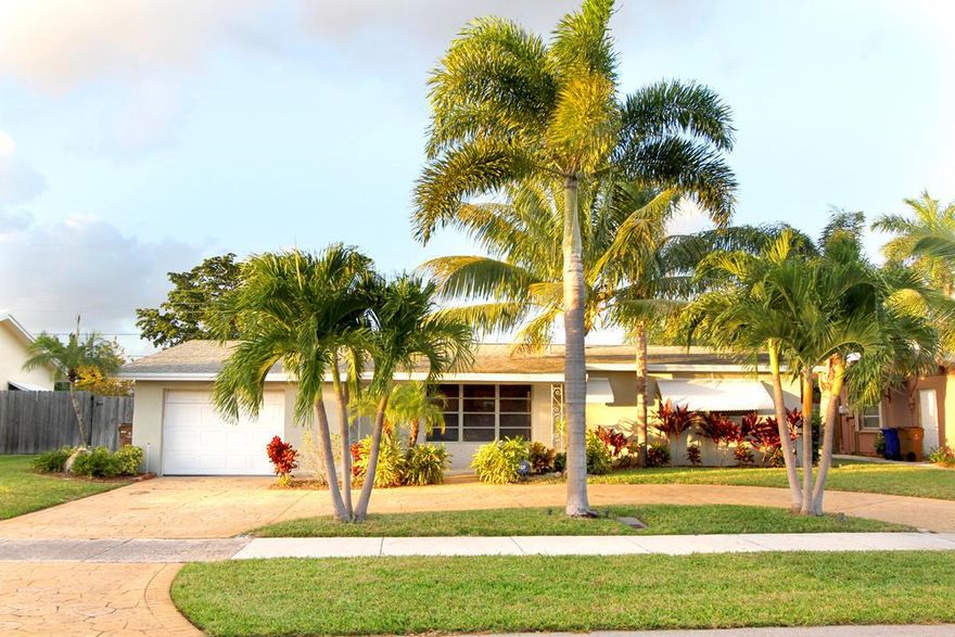 East Deerfield Beach single family home in beautiful Shorewood. This meticulously maintained home has lots of natural light, new LVT floors throughout (photos not updated), granite countertops, large real wood kitchen cabinets, updated bathrooms, blinds throughout, recess lighting, and fans, oversized one car garage with laundry and laundry sink, Newer AC unit... Spacious screened in patio overlooking a large fully fenced private backyard. Pets are Welcome. Ride your bike to the beach, close to restaurants,shopping and 95. First & Security moves you in with good credit and employment. Lawn Care included