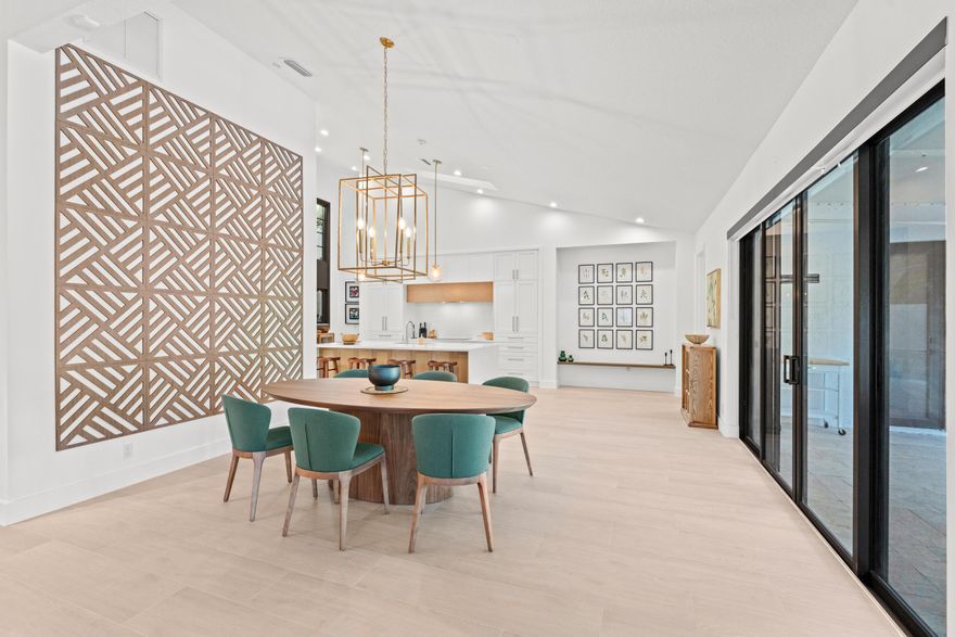 Welcome to a residence that embodies modern tranquility and sleek sophistication, located in the highly desirable Palm Beach Polo community. This fully renovated 3-bedroom, 3-bathroom home features a 2-car garage, soaring ceilings, and wood-look tile flooring throughout, all behind impact-rated windows and doors for comfort and security. The stunning chef's kitchen is a showpiece with a clean, modern design, built-in refrigerator, Monogram appliances, and an ASKO dishwasher, offering both beauty and performance. The open-concept layout is filled with natural light from expansive windows and skylights, flowing effortlessly into multiple living and sitting areas. Step outside to enjoy the South Florida lifestyle with a covered patio, cabana bath, and a beautifully designed private pool—   perfect for entertaining or relaxing in your retreat. Lush landscaping surrounds the property, with privacy provided by mature Clusia hedging, creating an intimate and tranquil outdoor space. The primary suite offers serene luxury with two custom-built-in walk-in closets, a spa-like bathroom, a water closet, and a Toto bidet. Two additional bedrooms feature custom-built-in-closets and share a stylish bathroom. Additional features include impact windows and doors, all-new designer finishes, built-in closet systems, high-end lighting fixtures, and a location just minutes from WEF, shopping, and dining. Whether you're seeking a year-round home or seasonal luxury space, this property offers the perfect blend of elegance, comfort, and location.