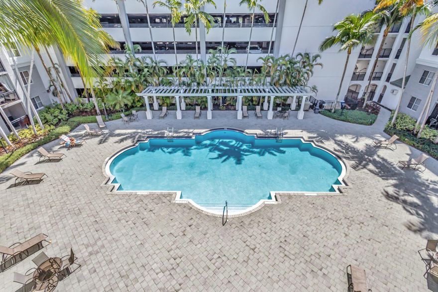 Largest floor plan in the building! Spacious 3BR/2BA condo in Vizcaya Lakes featuring luxury vinyl flooring installed in 2024, fresh professional paint, high ceilings, crown molding, and upgraded finishes throughout. Built in 2007 with newer construction standards. Enjoy the oversized double balcony with beautiful South Florida views. Pet-friendly community allowing up to 2 pets, plus a dog park for your furry companions. Resort-style amenities include 3 pools, spa/hot tub, clubhouse, fitness center, basketball court, billiards, and game room. Modern building with gated secure garage and 2 covered parking spaces. HOA includes insurance, water, cable, internet, trash, and sewer. Prime East Boynton Beach location close to dining, shopping, and entertainment