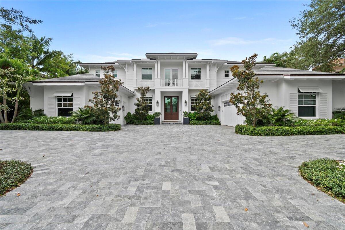 Welcome to this contemporary home nestled within the esteemed Admiral's Cove community, right in the heart of Jupiter. This remarkable 5-bedroom, 5 full (with one half) bath residence was expertly crafted in 2020 to exude elegance and sophistication.Stepping inside, you'll be immediately captivated by the breathtaking southern exposure views of the infinity pool and spa, with the tranquil intracoastal waters just beyond the great room. The kitchen is a true entertainer's delight, featuring double islands, dual ovens, a separate wine fridge, luxurious Calcutta Porcelain countertops, and top-of-the-line Sub Zero & Wolf appliances.Adjacent to the kitchen, a serene breakfast nook offers a perfect spot to enjoy meals while overlooking the pool area and the convenient summer kitchen.