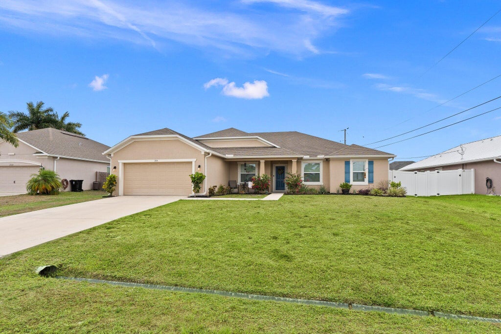 Photo of 2715 SW Hamilton Avenue, Port Saint Lucie, FL 34953 (MLS # R10995252)