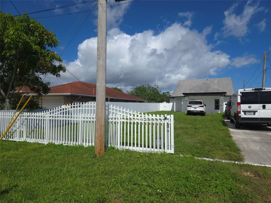Beautiful 3/2 in West Palm beach, close to Golf Club, restaurants, I95 and palm beach airport. This Home features tile throughout, freshly painted, new washer and dryer, new outside gate, high ceilings. lighting fixtures, spacious backyard and large driveway. Ready to move in!