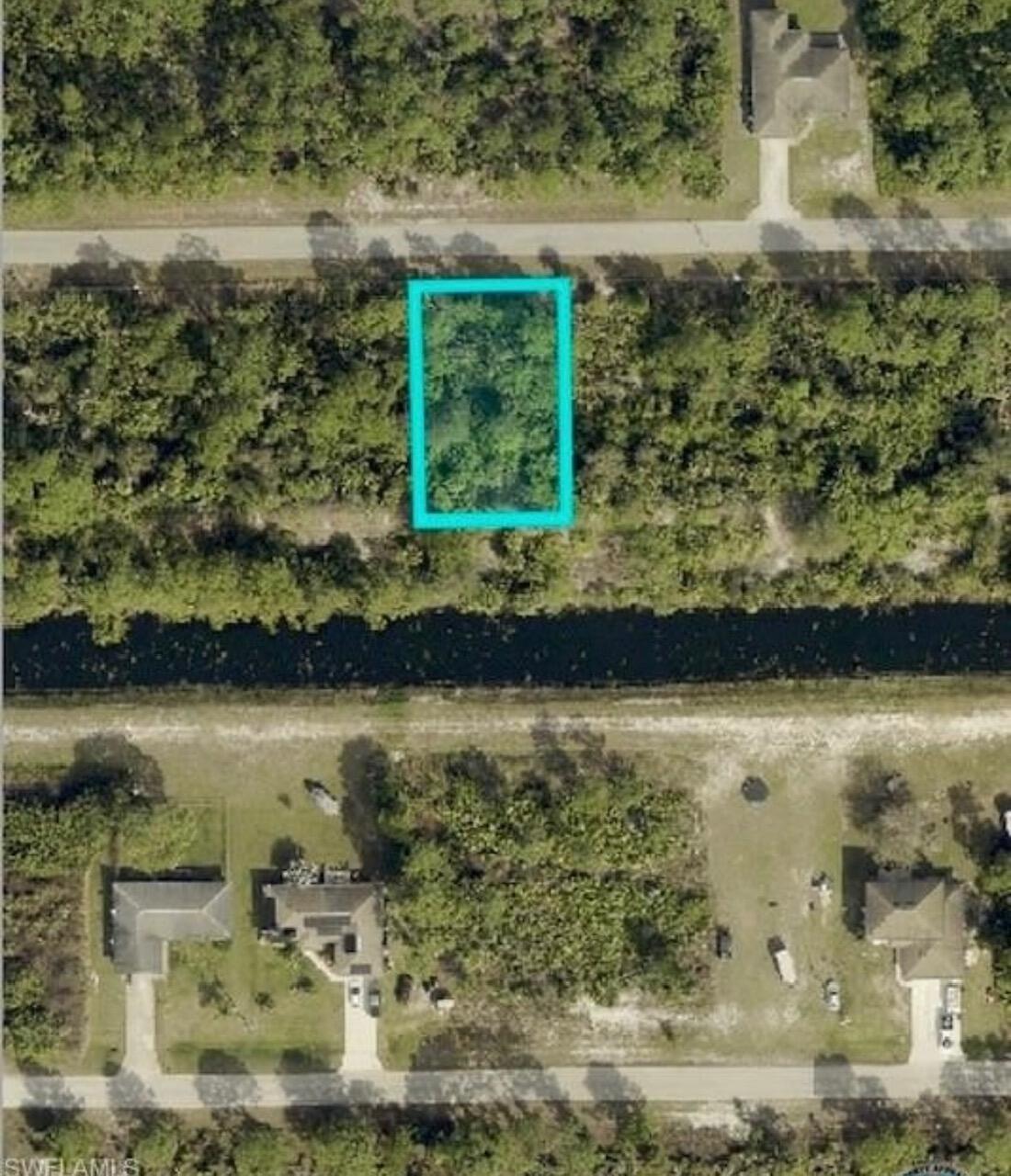This .25 acre lot in the east section of Lehigh Acres is high and dry, on a paved road and backs along a canal for extra privacy. All of this for under $19,000 is very rare in the city. You can enjoy many activities within a short drive such as... Shopping, JetBlue Stadium (Home of the Red Sox spring training), Hammond Stadium (Home of the Twins spring training) and Fort Myers Beach. Also for added convenience, Southwest International Airport is quick drive away, Don't miss out!