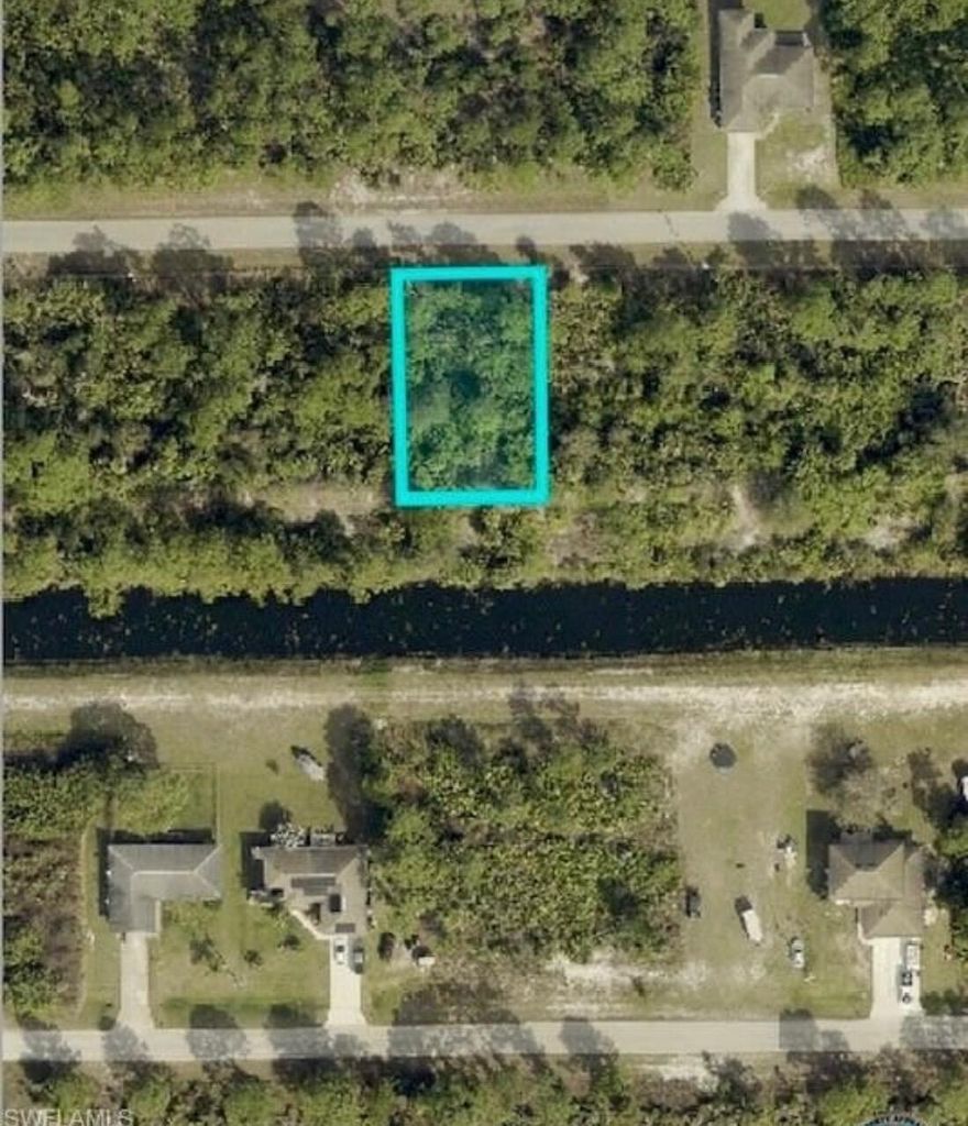 This .25 acre lot in the east section of Lehigh Acres is high and dry, on a paved road and backs along a canal for extra privacy. All of this for under $19,000 is very rare in the city.  You can enjoy many activities within a short drive such as... Shopping, JetBlue Stadium (Home of the Red Sox spring training), Hammond Stadium (Home of the Twins spring training) and Fort Myers Beach. Also for added convenience, Southwest International Airport is quick drive away, Don't miss out!