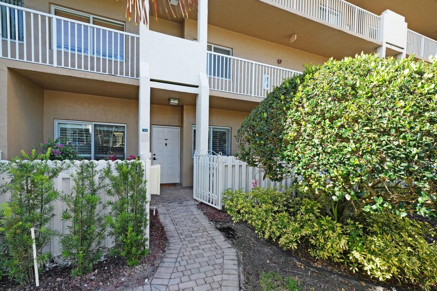 HIGHLY DESIRABLE first-floor unit in the Southampton section of Kings Point—offering true ease of living w/ a private walkway entrance, fenced & gated front porch, & assigned parking just steps from your door. This is one of the only opportunities in the community where pet ownership is permitted (<20 lbs), exclusive to first-floor residences. Inside, you'll find a thoughtfully updated interior, plantation shutters throughout, a spacious primary suite featuring a walk-in closet, & a bright, open layout designed for comfort & functionality. Hurricane-impact sliding doors provide added security & peace of mind. Located within a 24-hour gated community with a paid recreation lease, residents enjoy access to Kings Point's extensive amenities and community lifestyle!