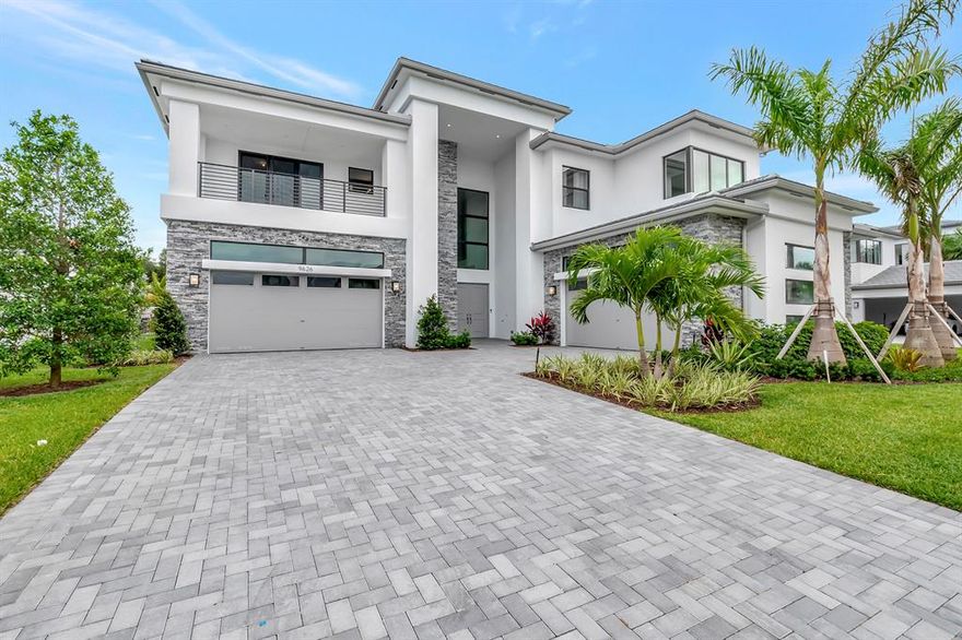 The Contemporary Riverside floorplan is one of the most sought after homes within Boca Bridges.  South-facing private lot.  5 bedrooms, 6.1 baths, 4-car garage, loft, retreat, club room, upstairs owner's suite with large covered balcony, great room, den & very spacious backyard that could easily accommodate a pool.  From the foyer throughout the living areas & upstairs to the bedrooms is rich wood flooring. The kitchen has SubZero refrigerator, Wolf gas cooktop & wall ovens, Bosch dishwasher, a steam oven, quartz counters, & farmer's style sink.  The club room features a wet bar. All the bedroom closets are fully customized & outfitted. Pre-plumbing & electrical stub-out for future BBQ & a pool.  Gas appliances. Impact glass throughout.  Water purification system.  Close to the 
Clubhouse Chic and sophisticated with timeless Luxury...this Contemporary Riverside floorplan is one of the most sought after homes in the Coastal Collection within Boca Bridges.  Sited on a south-facing private lot, the home has much to offer.  5 bedrooms, 6.1 baths, 4-car garage, loft, retreat, club room, upstairs owner's suite with large covered balcony, great room, den and very spacious backyard that could easily accommodate a pool.  From the foyer throughout the living areas and upstairs to the bedrooms is rich wood flooring. The kitchen is upgraded with SubZero refrigerator, Wolf gas cooktop and wall ovens, Bosch dishwasher, a steam oven, quartz counters, waterfall island and farmer's style sink.  The inviting club room features a wet bar to make entertaining fun and easy! All the bedroom closets are fully customized and outfitted. Each bathroom is uniquely styled. The owner has considered every detail. Additional enhancements include extra high hats, custom RH light fixtures, chandelier elevator in the foyer, custom floor to ceiling sheer draperies in all the bedrooms and living area, pre-plumbing and electrical stub-out for future BBQ and a pool.  Gas appliances.  Impact glass throughout.  Whole house water purification system.  The neighborhood is close to the clubhouse and the community amenities.