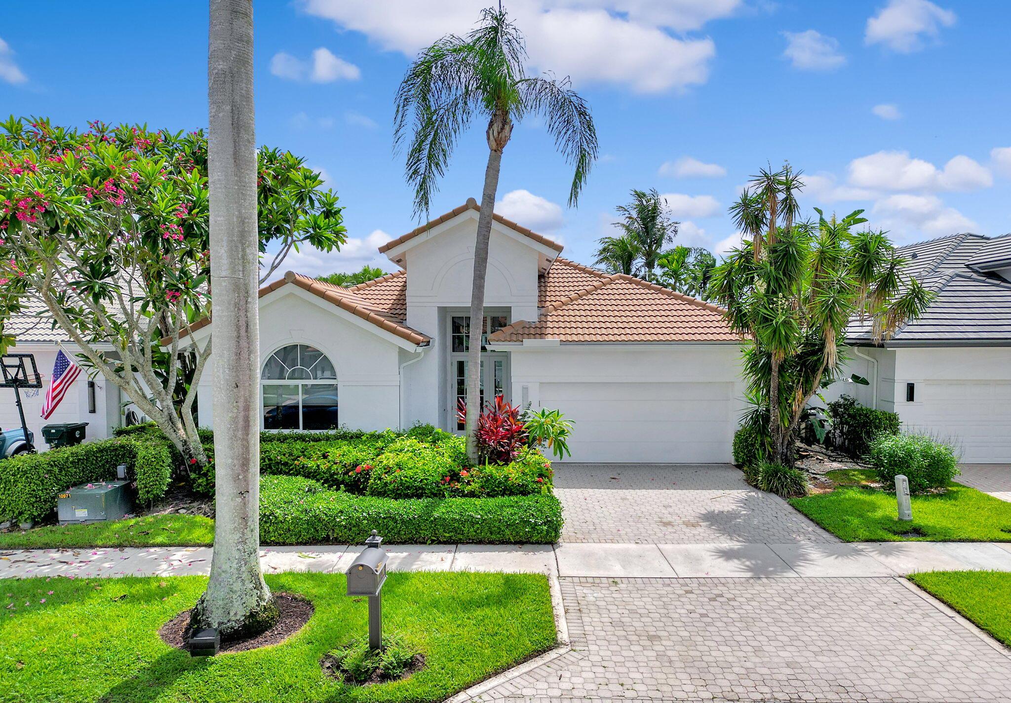 Experience the best of luxury and lifestyle in this immaculate 3-bedroom, 2.5-bathroom lakefront home located in one of the area's most desirable country club communities. Designed for both comfort and sophistication, this residence offers soaring ceilings and an abundance of natural light. The heart of the home features a gourmet kitchen with high-end appliances. The open living and dining areas boast expansive lake views.