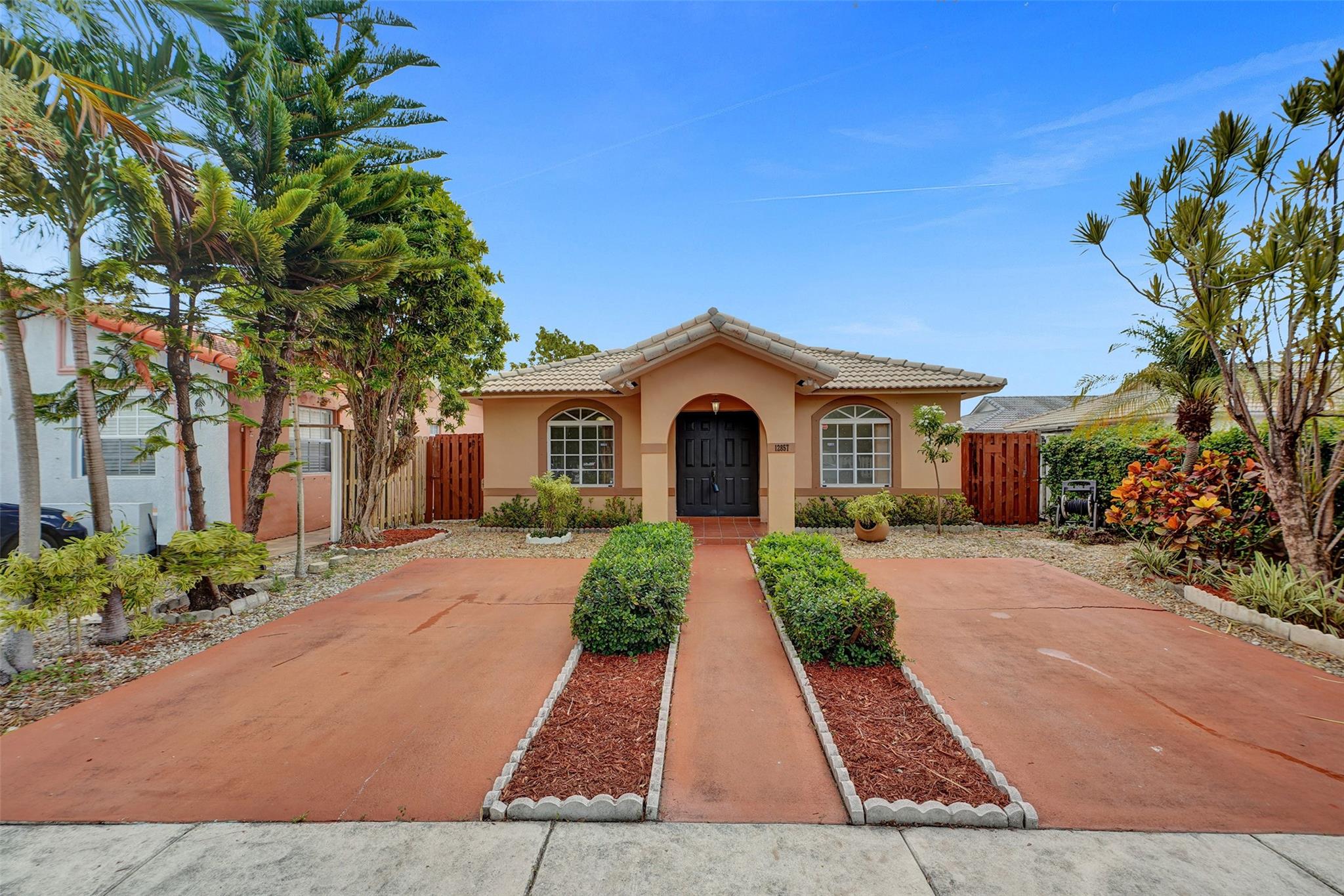 Wow! This is it! Just listed Move-in ready 3 bed, 2 bath single family home in Hialeah Gardens - With NO HOA! Freshly painted, this charmer features Vaulted ceilings and brand new floors in all bedrooms. The master suite features a spacious, updated bathroom with sleek finishes. The lot is fully fenced for privacy + pets. Enjoy year-round outdoor living under your private covered patio. Plenty of parking and Conveniently located near highways, shopping, dining, and more! Best of all it is listed at an incredible price for a well-kept home in a prime location. Easy to show, call today for more information, you don’t miss this gem!