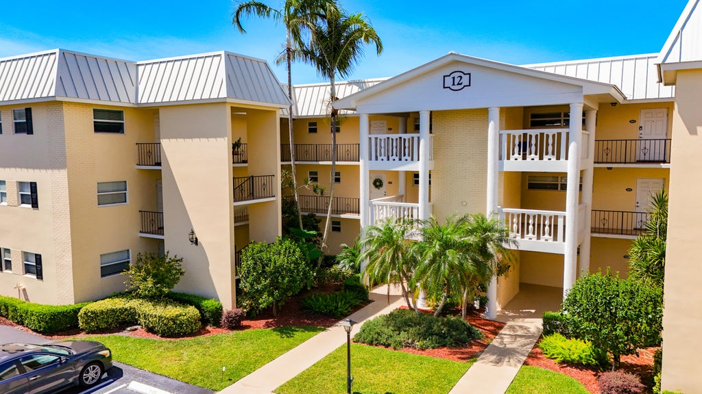 Photo of 12 Colonial Club Drive #202, Boynton Beach, FL 33435 (MLS # B26040768)