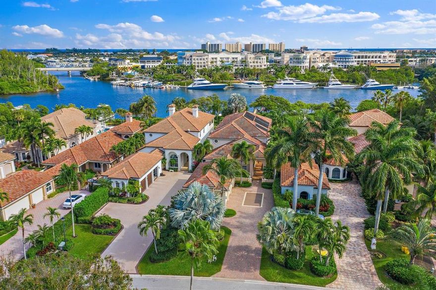Wow! You really can have it all! This spectacular water front home boasts a dream location in the heart of Jupiter directly on the Intracoastal waterway. A true boaters paradise with ocean access just minutes away and no fixed bridges. The private dock is equipped with a 20,000 lb lift. Views across the tropical pool deck, manicured mangroves and waterway extend to the multi million dollar yachts moored across at Harbourside. Nestled in the Intimate, gated community of 'Waters Edge Estates' with only 19 homes. Close to Jupiter's beautiful beaches, shopping and a wide variety of dining options. Built in 2003 this elegant CBS home provides 4730 SQ feet of under air accommodation . With 5 bedrooms, 4 bathrooms, 2 half baths, office, 3 car garage, heated pool/spa and safety glass windows