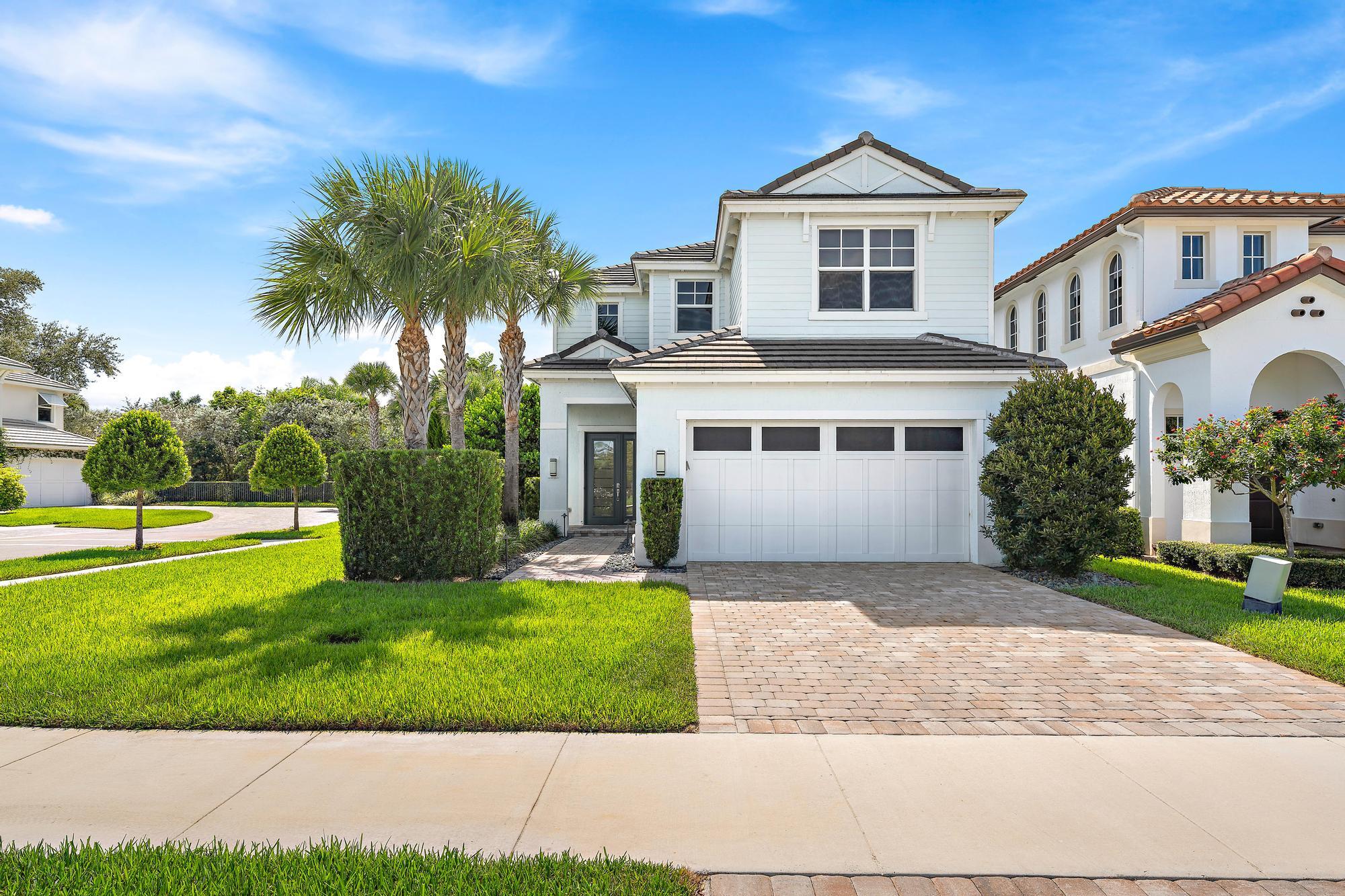 MODERN ELEGANCE in the heart of Palm Beach Gardens, this 4 bedroom, 4 bathroom pool home with over 2,500 sq ft of living space is located in the gated community of Bonnette Hunt Club. Built in 2021 with high-end upgrades throughout, this home is the perfect annual rental opportunity or full-time residence. Enjoy a bright open floor plan, private backyard oasis, and modern finishes at every turn.Step inside to find tile flooring on the main level, a designer kitchen with oversized quartz waterfall island, GE Profile stainless appliances, wine fridge, and sleek white cabinetry with gold accents. The spacious family room is filled with natural light from full-length sliding glass doors that open to your private pool and spa.One guest bedroom and full bath are located downstairs,