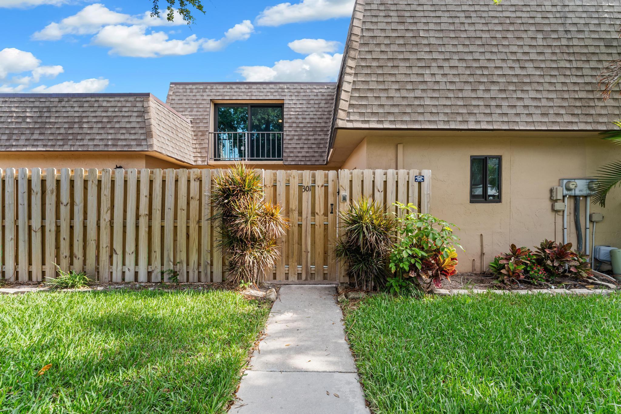 Charming 3-Bedroom Townhome with New Roof & A/C in Waterview Estates! Welcome to this comfortable and inviting home that perfectly blends space, style, and convenience. Enjoy a beautifully landscaped front courtyard. Inside, the primary bedroom is located on the main floor and the additional two bedrooms are upstairs. This home features newer 3-ton Rheem A/C unit with Nest E thermostat, washer and dryer, and a thoughtfully updated kitchen and bathrooms with modern finishes. The home comes with 2 assigned parking spaces to add convenience. Enjoy peace of mind with a newer roof and full hurricane impact windows and sliding doors, and take advantage of all the amenities Waterview Estates has to offer, including tennis courts, a basketball court and a community pool.