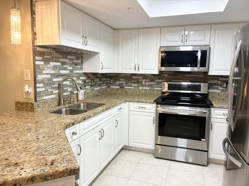 Photo of 1000 CRESTWOOD Court S #1005, Royal Palm Beach, FL 33411 (MLS # B26076992)