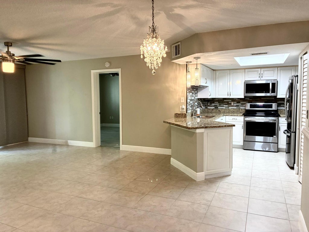 Photo of 1000 CRESTWOOD Court S #1005, Royal Palm Beach, FL 33411 (MLS # B26076992)