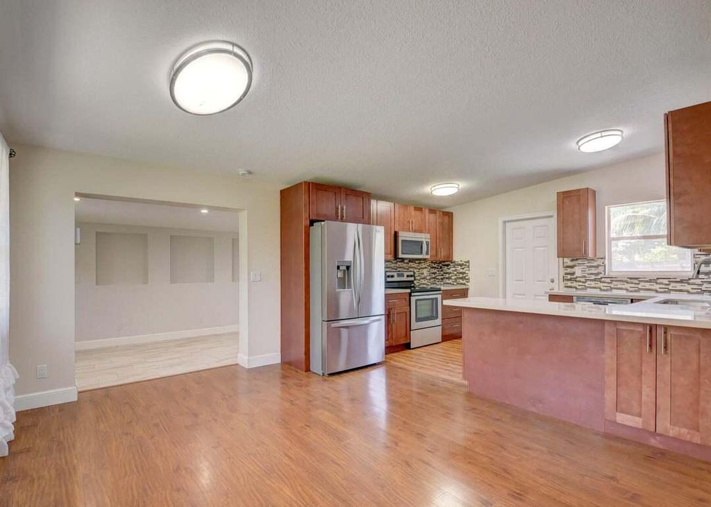 Photo of 612 Hibiscus Drive, Royal Palm Beach, FL 33411 (MLS # B26010502)