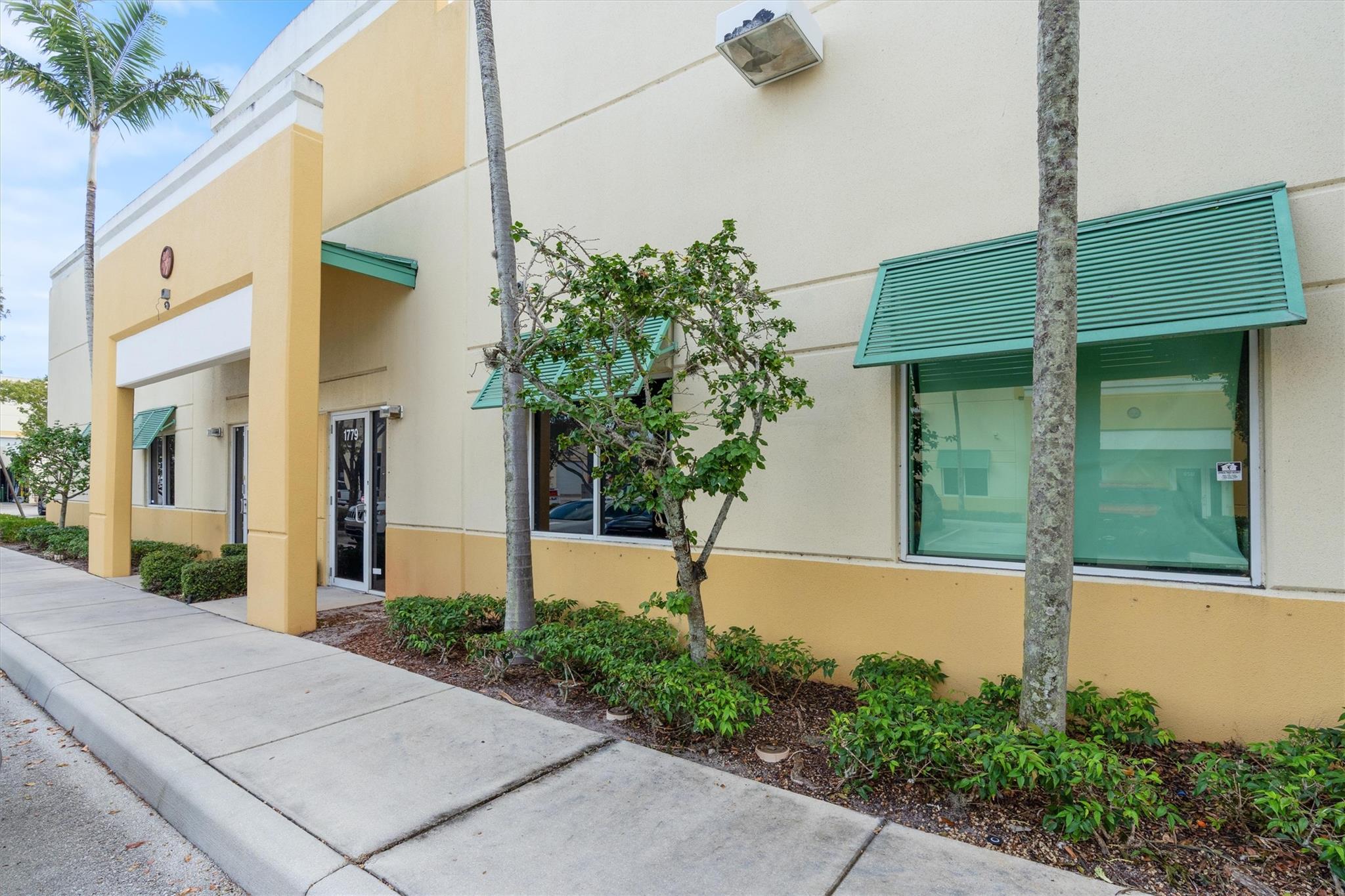 Flex Warehouse Property For Lease. 4,875 SF. Office area of 1,350 SF and 3,525 SF warehouse. There are 3 overhead 12 x 14 grade level doors on rear of building, unit is located at end of building. There are 2-3 private offices, open work area, and 2 bathrooms. Property has 6 reserved parking spaces. Building is concrete tilt wall construction and concrete twin-T roof deck, with 20' +/- clear ceiling height in warehouse.