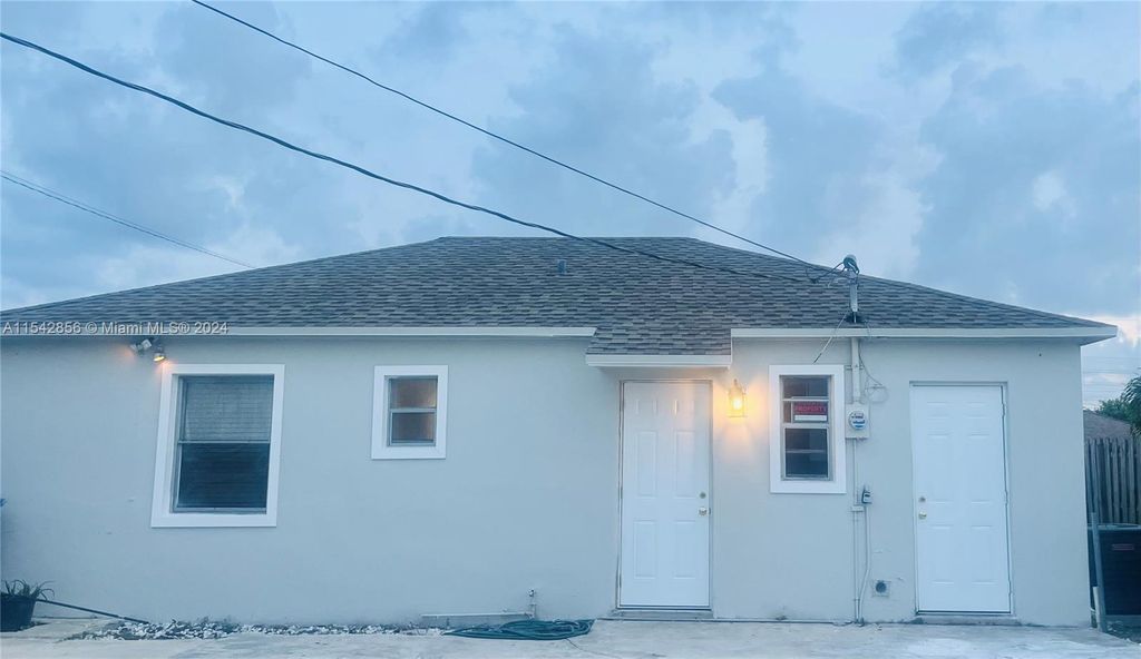 Photo of 800 W 3rd Street, Riviera Beach, FL 33404 (MLS # R11069385)