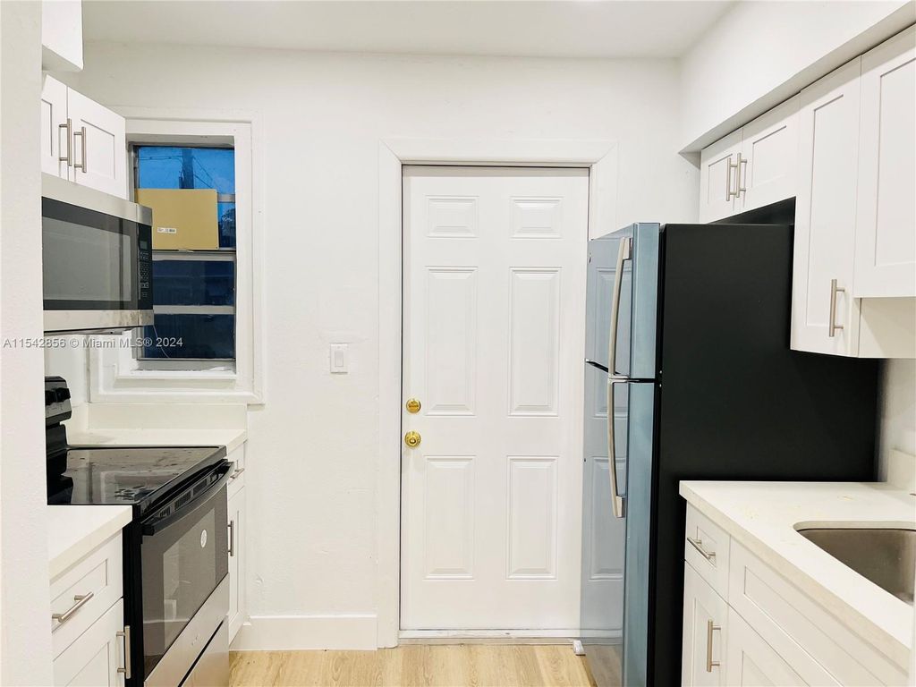 Photo of 800 W 3rd Street, Riviera Beach, FL 33404 (MLS # R11069385)