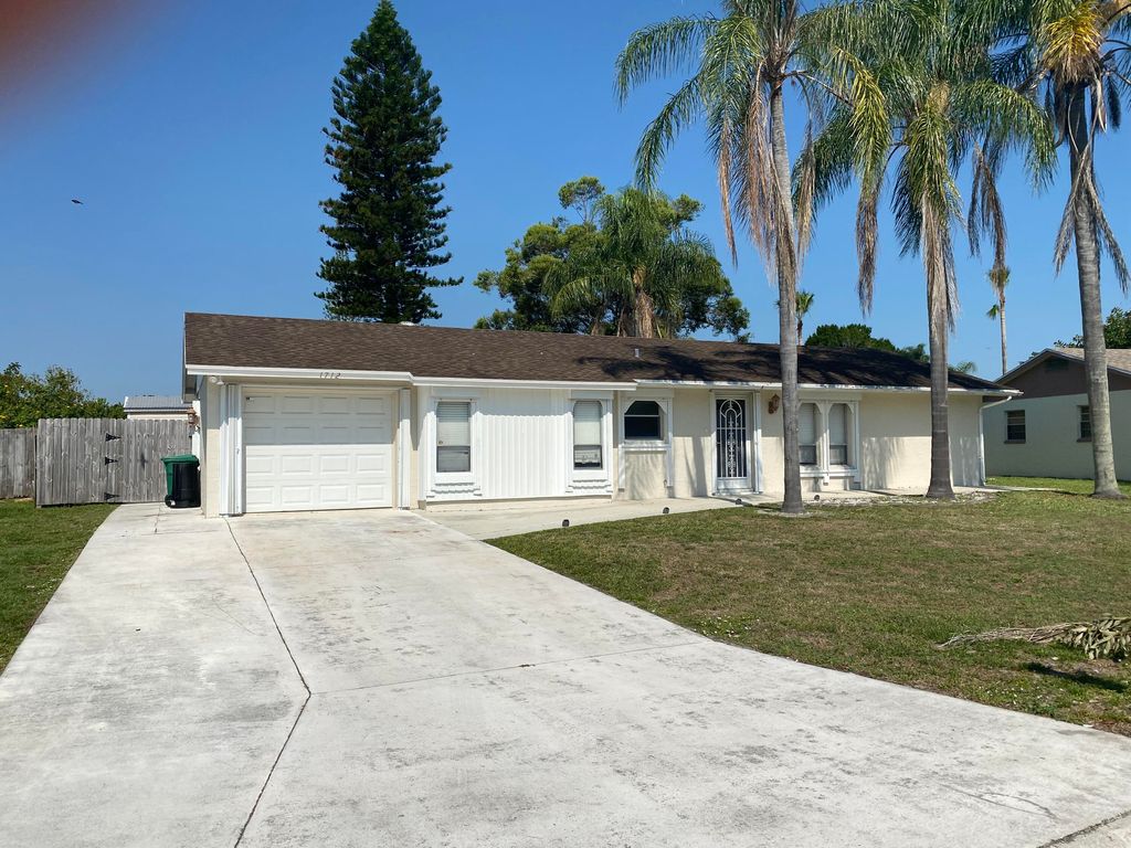 Photo of 1712 SE Burgundy Lane, Port Saint Lucie, FL 34952 (MLS # R10799122)