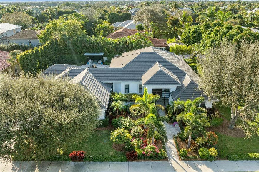 Nestled on an exceptional corner lot in the heart of Lake Ida, this home has been thoughtfully reimagined to maximize space, functionality, and luxury. The main house offers three spacious bedrooms, plus an office/den, two full bathrooms, and two half bathrooms, including a cabana bath with convenient access through the laundry room and exterior entrance. Every detail has been meticulously elevated to combine both elegance and comfort.A private one-bedroom, one-bathroom guest house adds versatile living options. With its own kitchen, laundry, separate entrance, and a full living area, it offers flexibility to function as an independent residence or integrate seamlessly with the main house for additional space.The expansive backyard is a true entertainer's paradise. Featuring