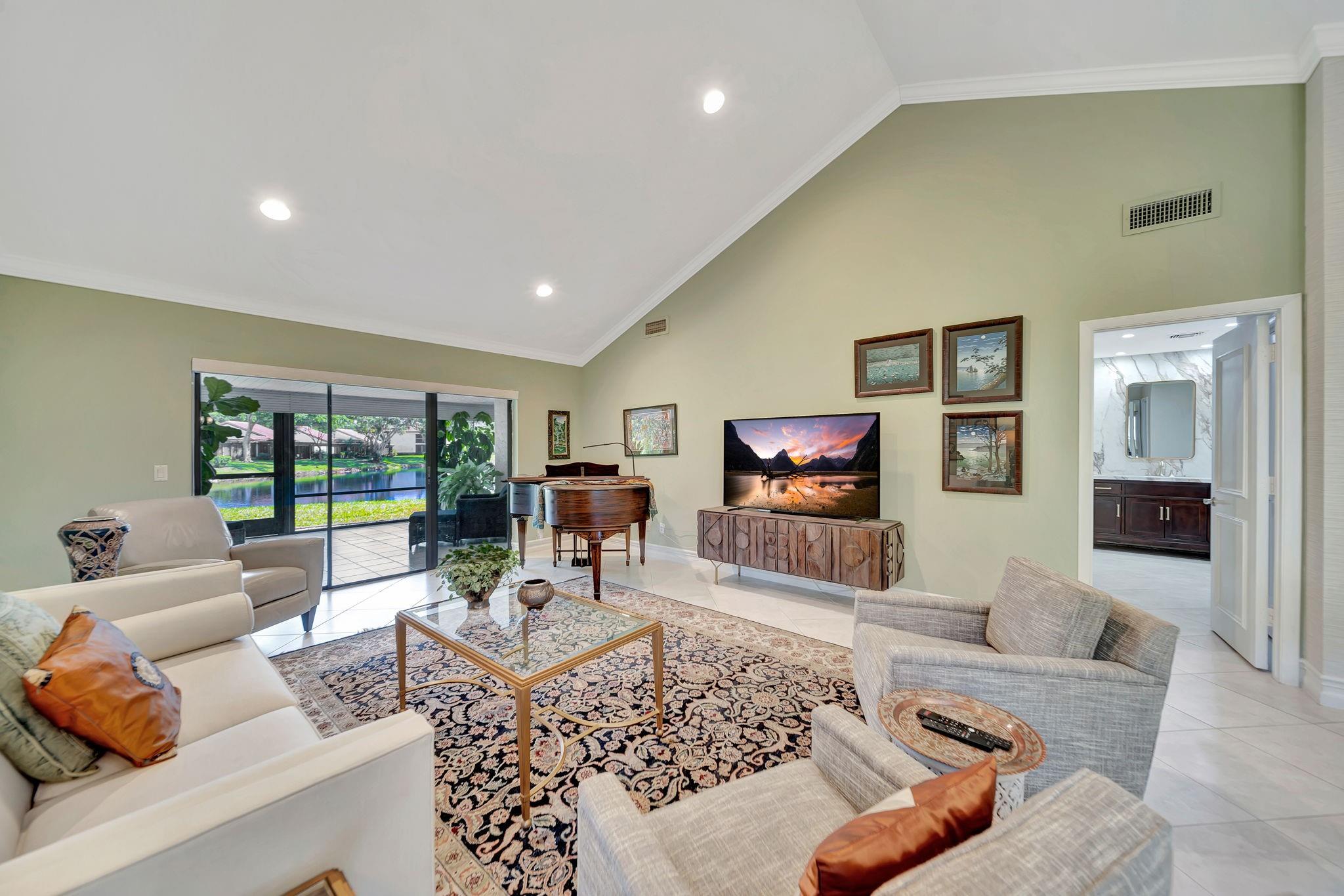 Florida living at its best in this rarely available corner villa in the beautiful Glades of Boca Lago! This vibrant 55+ community is the perfect place to call home. Spacious two bedrooms, two baths, eat-in kitchen, and a large enclosed patio area. This villa is complemented by high ceilings, tile floors, a newer roof (2021), renovated baths, newly painted, all stainless steel appliances, newer blinds and doors throughout, and much more. Reduced Cable TV and Internet bill $20 a month. Glades of Boca Lago is a community located in exclusive Boca Raton. It is known for its beautiful landscapes, golf course views, and resort-style living. This community features various amenities, including a pool, clubhouse, and recreational facilities.