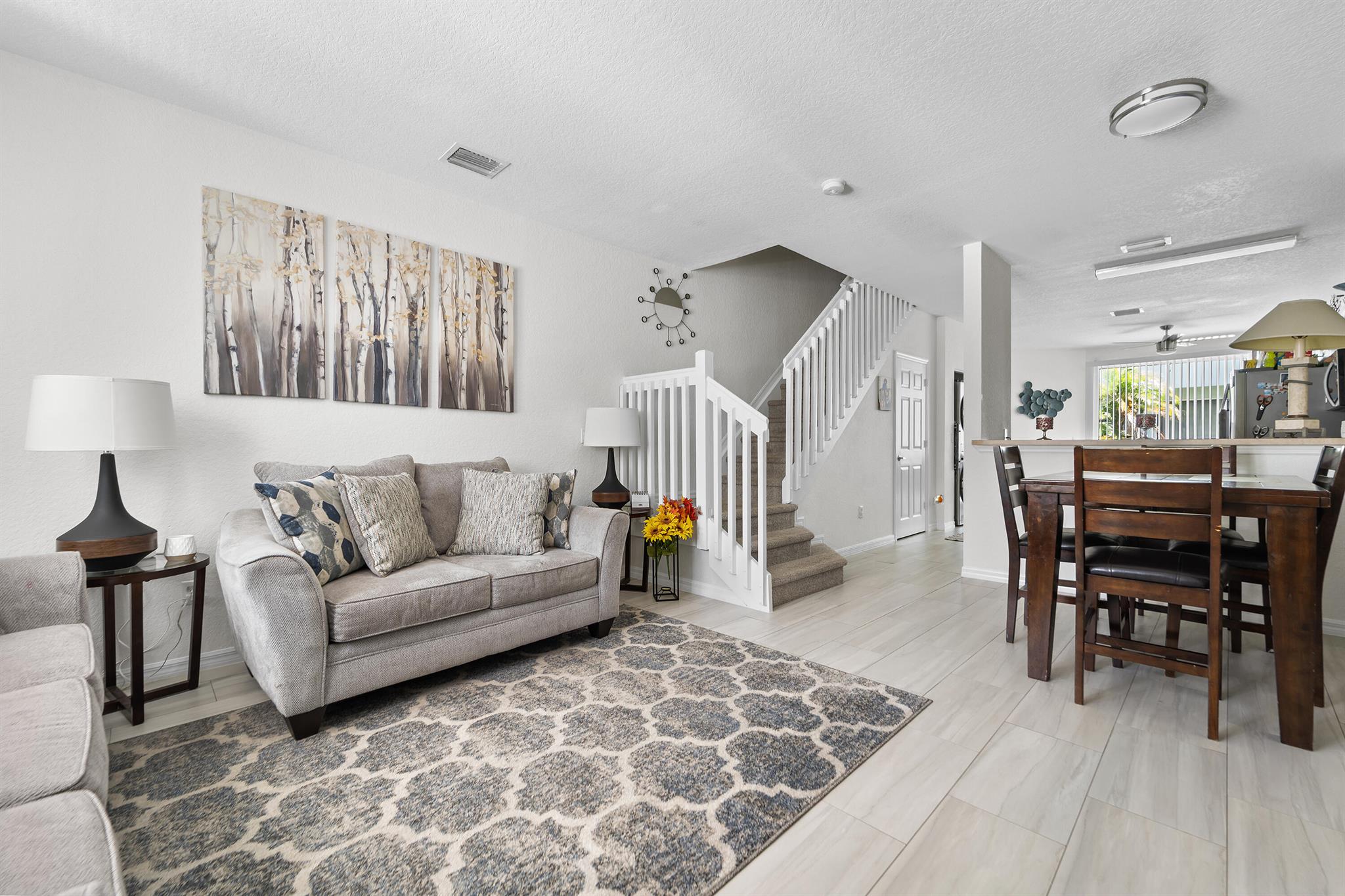 This charming 3-bedroom, 2.5-bathroom townhouse blends modern updates with cozy comfort. Enjoy brand-new floors downstairs, a sparkling new stove and microwave in the updated kitchen, and the convenience of a new washer and dryer. Stay cool year-round with a brand-new 2024 A/C unit. With bright, open living spaces and a private patio, this home is move-in ready and full of charm!