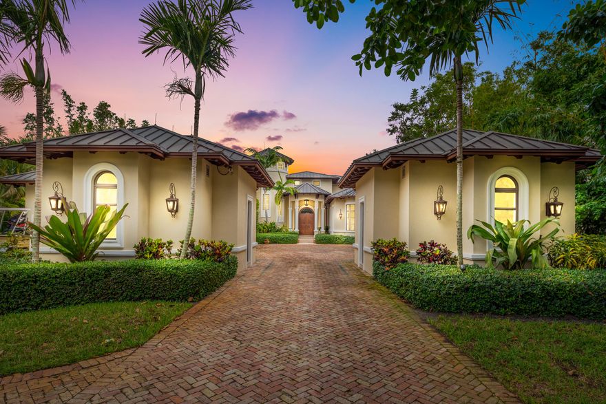 Majestic Waterfront Estate situated on over 1.23 acres and 26 feet above sea level.  Very few homes homes have their own tropical oasis with a private beach! Over 11,000 total square feet of luxury living featuring 2 masters suites, plus another 3 bedrooms, 2 laundry rooms & a private boat house that has been grandfathered in. Truly one of a kind! Complete CBS construction, with 2nd floor poured concrete & copper roof. This house is a fortress.  Whole house generator and all impact glass. 5 car garage for the car enthusiast.  Two boat lifts, water depth at low tide is 4 feet.  Those with a mega yacht, Sailfish Marina is within walking distance!  Outdoor living featuring salt water pool & complete full kitchen with teak cabinets and bar.  Too many special features to list!  One of the most One of the most magnificent waterfront estates to ever hit the market in Stuart.