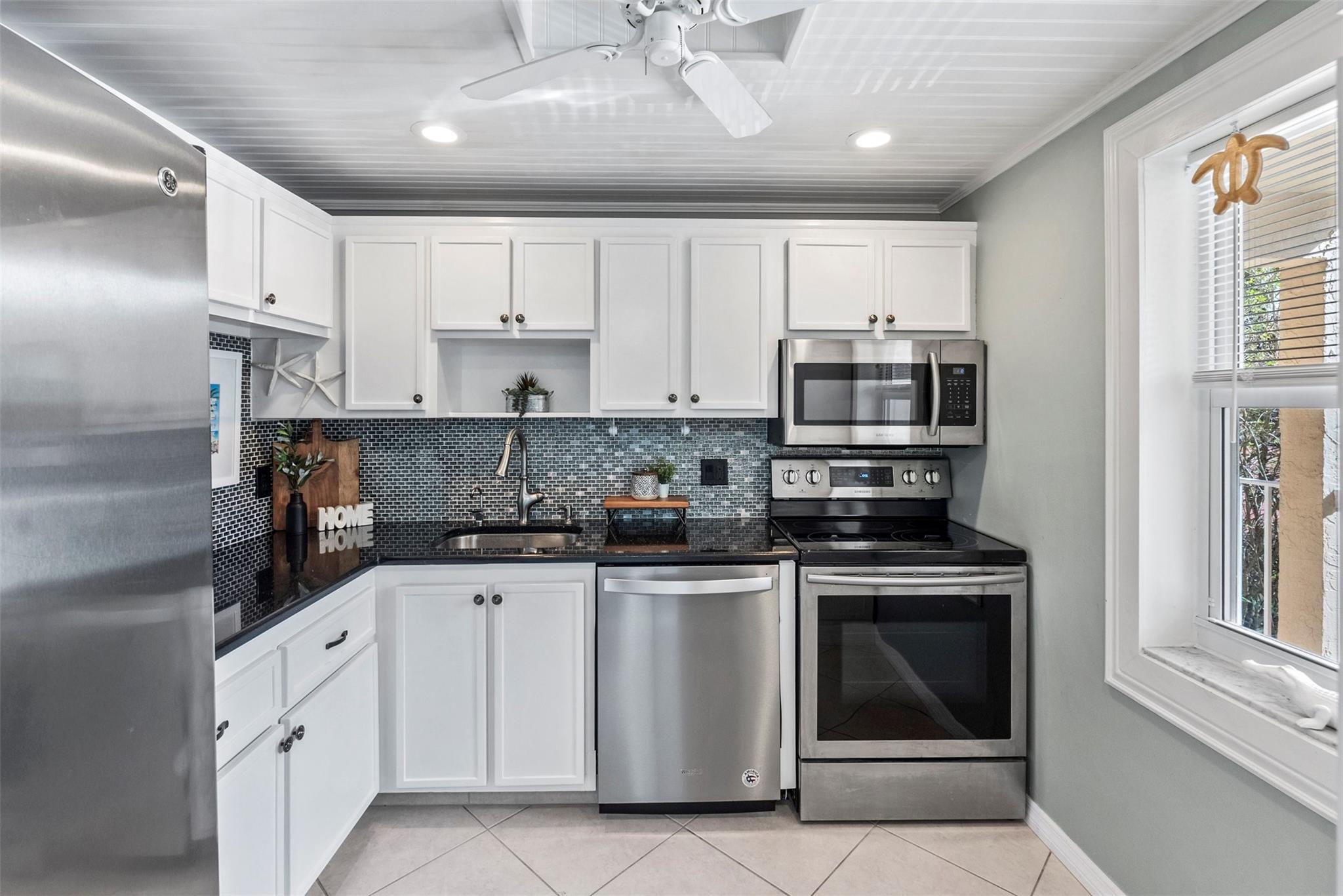 *Updated, Clean & Feels like Home* This updated 2BR/2BA condo with golf views is TRULY turn key, just bring your things and enjoy the privacy of your screened in patio space. Large kitchen with plenty of counter space and an added built in storage space. Modern updated bathrooms, recently painted interior, 2024 AC, 2021 Water Heater and open spacious living space makes this the seasonal or permanent home sweet home. Elevator 2 doors down, Key locked storage unit & Laundry one door down! Oriole Golf & Tennis is 55+ living at its finest with two heated swimming pools, a fitness center and a billiards room. *Healthy association* No Assessments. Buyers must have 725 min credit score + minimum income requirement of $40,000/year.