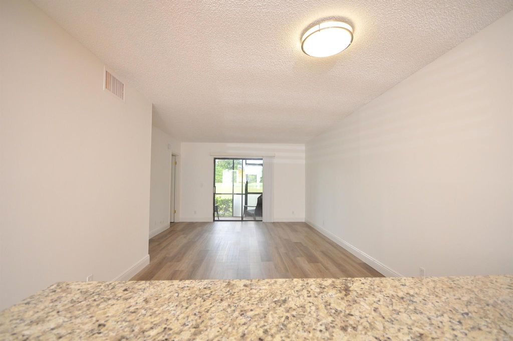 Photo of 7101 Golf Colony Court #103, Lake Worth, FL 33467 (MLS # R11117143)