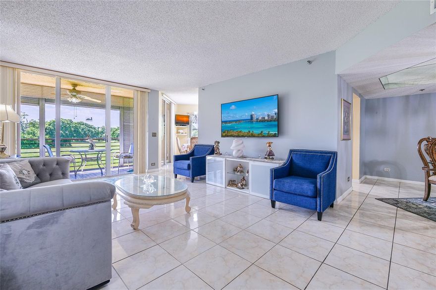 WHAT AN AMAZING PRICE!!  LARGEST CORNER 2/2 UNIT 1721 TTL SQ FT!!!  ENJOY GORGEOUS VIEWS OF THE SUNSET FROM YOUR EXTRA LARGE TERRACE 208 SQ FT!!   ALL ROOMS OPEN OUT ONTO WITH SLIDING GLASS DOORS ON TERRACE WITH ROLL SHADES!  UNIT IS TILED THRUOUT EXCEPT FOR CARPET IN MASTER BEDROOM. KITCHEN NICELY REMODELED WITH GRANITE COUNTERS & STAINLESS STEEL APPLIANCES! A 55+ AND OVER COMMUNITY. JUST A FEW PERSONAL TOUCHES NEEDED! ASSOCIAITON SAYS 700 CREDIT AND $55,000 INCOME. INCLUDED IN MAINTENANCE IS WATER, PEST CONTROL, INSURANCE OF THE BUILDING, INTERNET, CABLE TV & HBO, & CULTURAL CENTER WHICH OFFERS: BOWLING, SHUFFLEBOARD, TENNIS, PICKEL BALL, BILLIARDS, GYM, JACUZZI, & MANY ACTIVITIES! YOU WILL LOVE LIVING HERE! COME SEE FOR YOURSELF!  A GATED COMMUNITY!