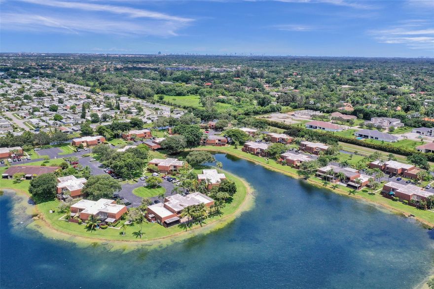 Discover the perfect blend of comfort, convenience, and lakeside charm in this corner-unit townhome. Bright and tranquil water views welcome you from every room, creating a peaceful atmosphere throughout. The open main level features sliding doors that lead to a private patio, a beautiful natural wood staircase, a convenient downstairs bedroom or home office, half bath, and a kitchen highlighted by a stylish Italian backsplash. Upstairs, enjoy porcelain tile flooring throughout, an expansive primary suite with panoramic lake views, walk-in closets, and a spacious ensuite full bath. The second bedroom offers its own balcony and serene lake views. New roof (2020), A/C (2021), impact front door, and accordion shutters. Low HOA fees, top-rated schools, and resort-style amenities.