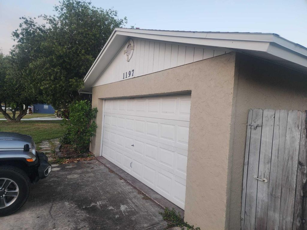 Photo of 1197 SW Heather Street, Port Saint Lucie, FL 34953 (MLS # R11146778)