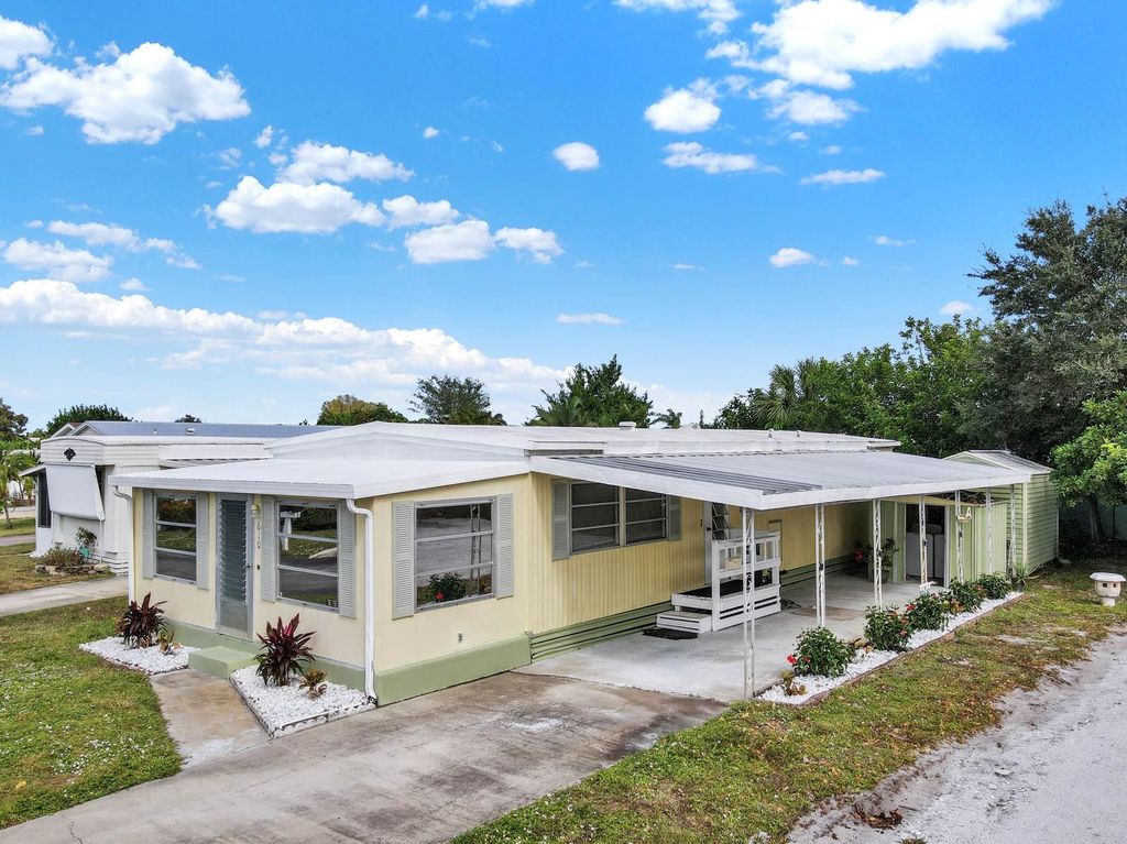 Photo of 610 NE Tahiti Way, Jensen Beach, FL 34957 (MLS # F10410959)