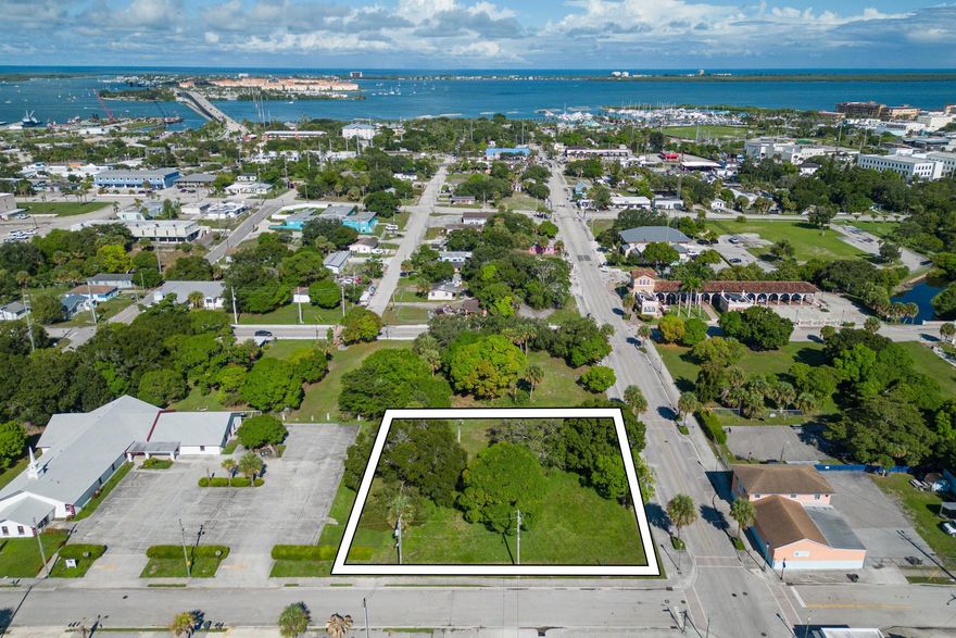 Opportunity to acquire a strategically located commercial parcel just minutes from Downtown Fort Pierce, adjacent to the King’s Landing development—a transformative project featuring luxury condos, fine dining, and a boutique hotel. Situated in close proximity to the Fort Pierce Mega Yacht Marina and the highly anticipated Fisherman’s Wharf revitalization, this property is perfectly positioned to benefit from the area's explosive growth. Zoned for commercial use with excellent visibility and accessibility. Don’t miss your chance to invest in one of the fastest-growing corridors on the Treasure Coast! Price includes adjacent lot totaling around .35 acre. MLS #F10524918