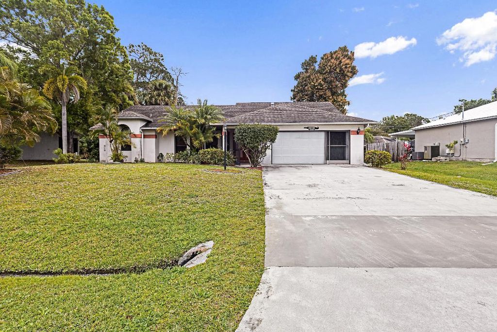 Photo of 2361 SW Woodridge Street, Port Saint Lucie, FL 34953 (MLS # R10960917)