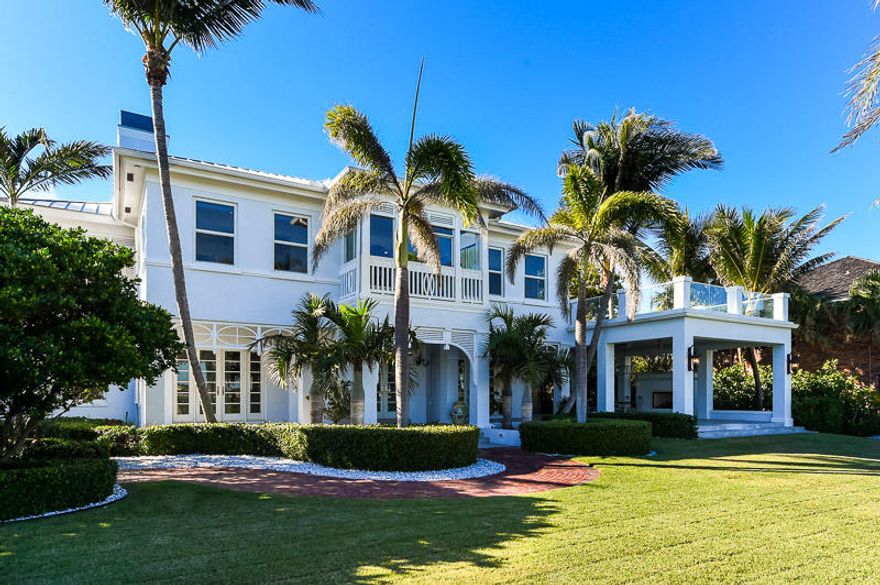 Enjoy expansive views of Palm Beach and the intracoastal waterway from this spectacular home on South Flagler Drive.
This recently renovated 6 bedroom, 6 bath Bermuda style home has beautiful water views from almost every room.  
The open living plan is light, bright and airy with beautiful newly refinished hardwood floors and updated fixtures throughout.
From the idyllic palms and expansive water views to the sought after entertaining spaces and airy enclaves, this is truly an exceptional home.  This traditional Bermuda style home is complete with six bedrooms, six baths, full impact glass, and a deep water dock with a boat lift. From the grand entry staircase and high ceilings, updated fixtures, and fabulous indoor and outdoor living spaces, this is truly one of the finest waterfront homes in West Palm Beach.