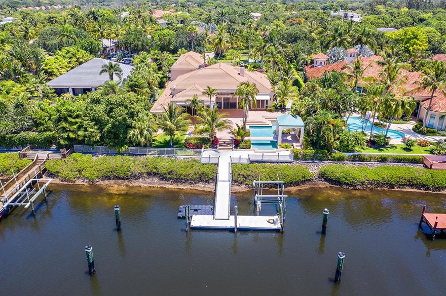 Vacant and Easy to Show!   This custom home has a Rare Social Membership in Admirals Cove.  The larger lot has 110 feet of waterfrontage perfect for a boater to have a larger vessel behind their home.   Easy access to the Intracoastal waterways.  The home has 5 bedrooms and 5 full baths and 2 half baths, 4 car garage, a theater room, and so much more.
