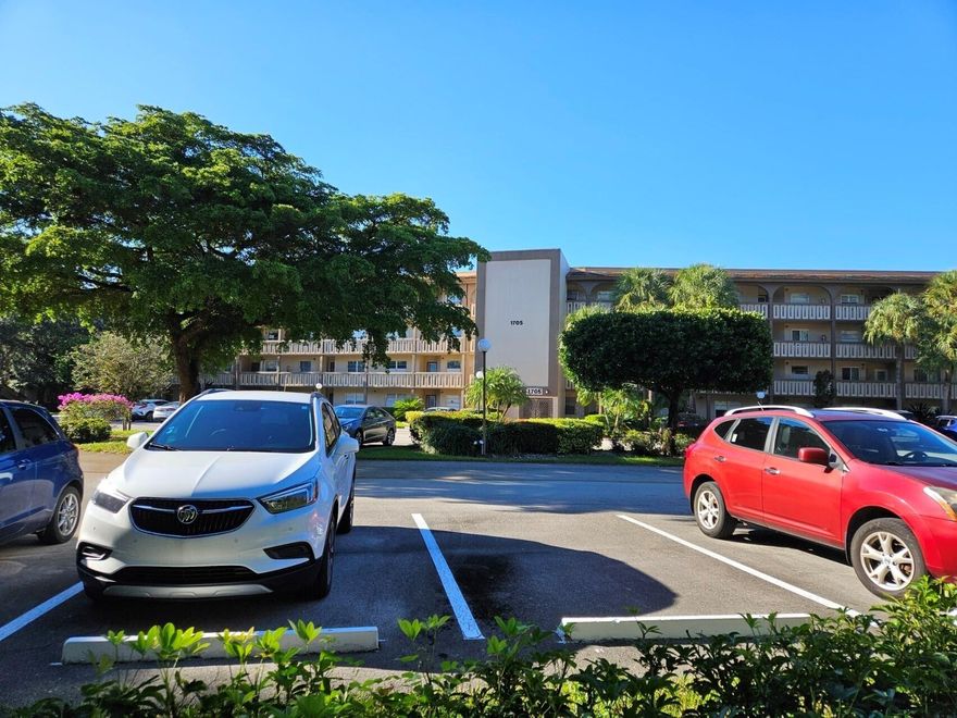 WOW,1 of a kind corner unit on a lake! HUGE Unit! Absolutely stunning w/an upgraded kitchen w/white shaker cabs, Italian Porcelain tile backsplash, Quartz countertops, GE SS kitchen suite. Gorgeous plank Porcelain tile floors in the living areas & luxury vinyl floors in the beds.  Newer baseboards are real Pine wood 5.5". Newer IMPACT WINDOWS AND FRONT DOOR. Both bathrooms have been upgraded& new electrical outlets. All new HIGH END interior doors. This beautiful unit is light bright and airy with WINDOWS all along the side giving loads of light in each room. Enclosed patio could be an extra room. This is a Golf Course Comm w/ many clubs, fitness center, theater, tennis, pickeball. Roof is less than 2 yrs old, getting new catwalk, NO ASSESSMENTS!