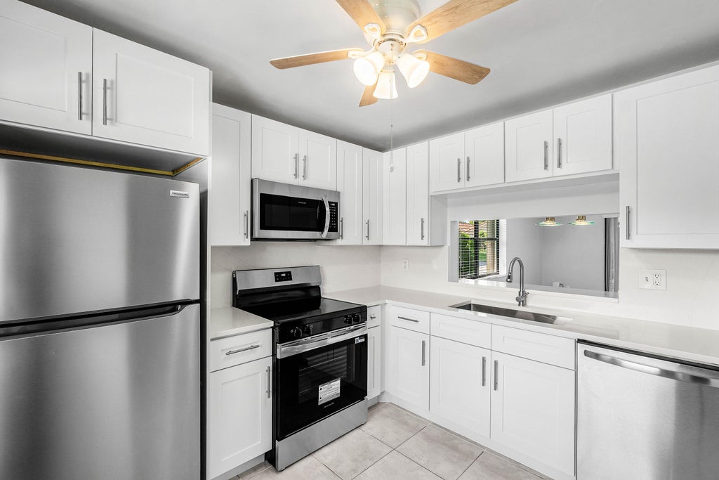 Photo of 5162 Tennis Lane, Delray Beach, FL 33484 (MLS # B26041744)