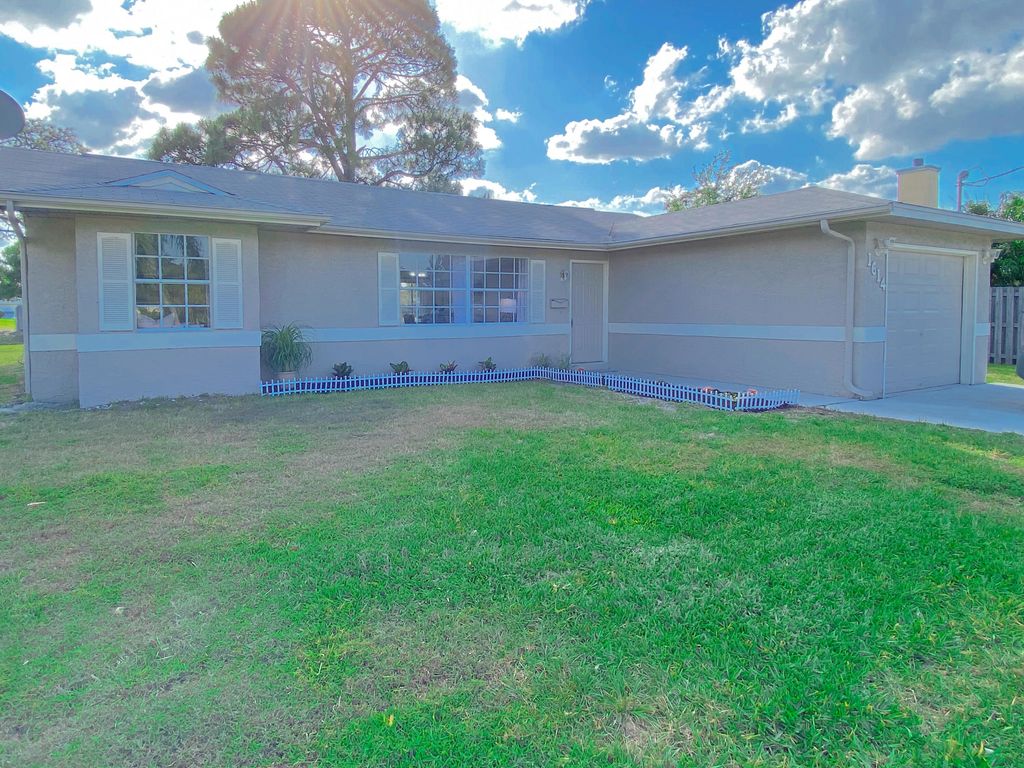 Photo of 1614 SW Airoso Boulevard, Port Saint Lucie, FL 34984 (MLS # R10788139)