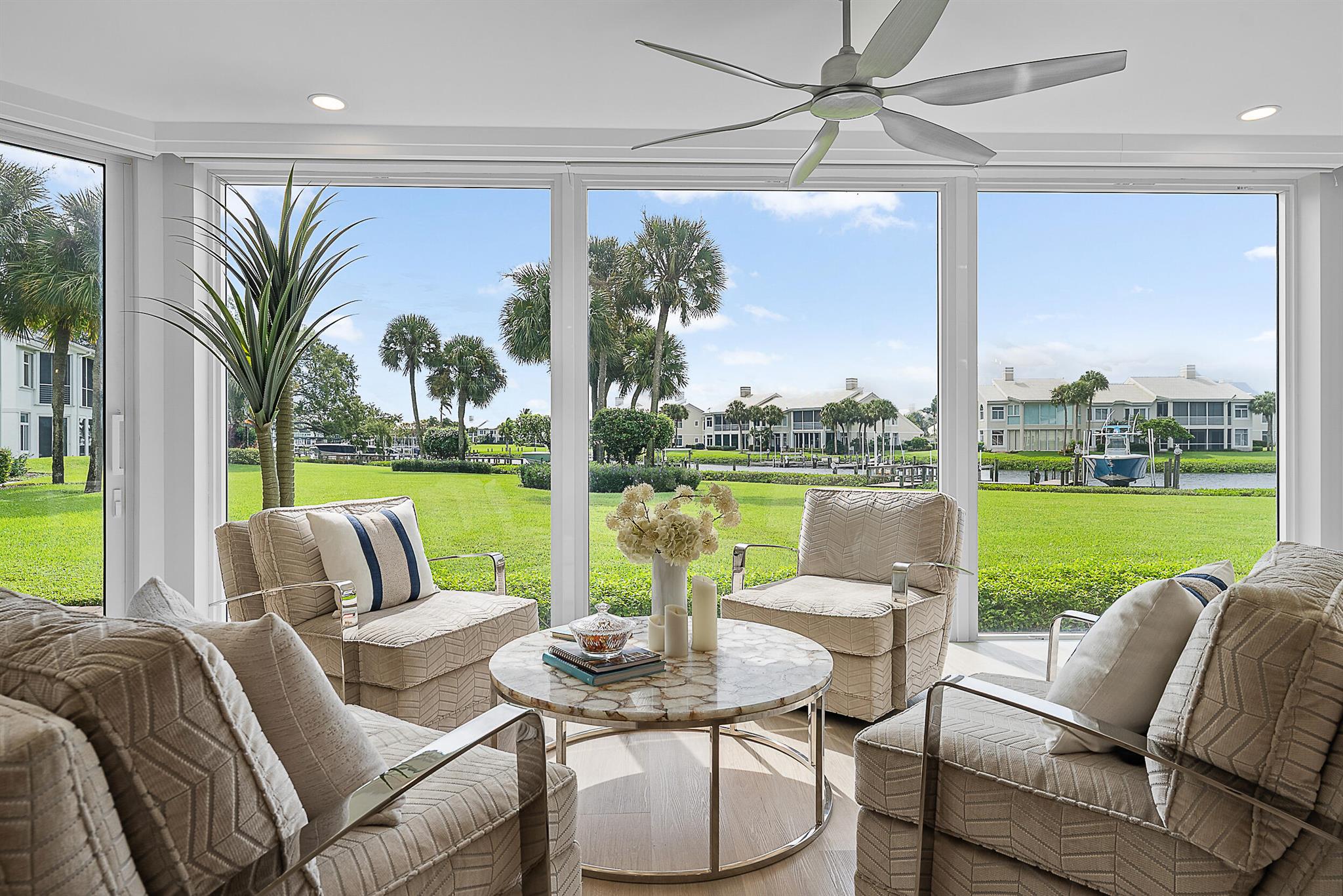 Welcome to waterfront elegance in the prestigious Admirals Cove community. This beautifully renovated and fully furnished condo offers stunning views of the tranquil waterways through expansive impact storefront windows that flood the space with natural light. Enjoy the convenience of your own private dock, perfectly suited for a 34-foot boat, making every day a potential adventure on the water. Located just steps from the Club, Marina, Tennis and Pickleball courts, this residence places you at the heart of an active and luxurious lifestyle. With designer finishes, modern upgrades, and a seamless blend of comfort and style, this condo is a rare opportunity to live the Admirals Cove dream.