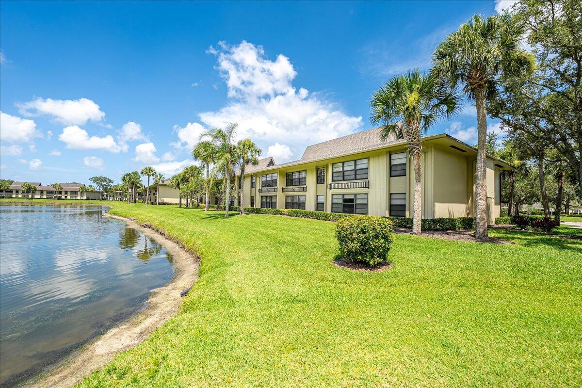 Welcome to Vista Plantation, a quiet community with gorgeous lake and golf course views! This ground floor unit is perfect for your main residence or your escape from the cold! Seller has done updates throughout including new appliances in the kitchen with quartz countertops and new, soft close cabinets with slide out drawers. This unit features tile throughout, impact windows, walk in closets, a washer/dryer in unit, 2021 water heater and an updated bathroom with a Safe Step walk-in tub for convenience and relaxation. Both the living room and bedroom have an expansive, private lake view with the golf course. Quiet community located in the heart of Vero you are right around the corner from restaurants, shopping, pharmacies, just a short drive to the beach and more!