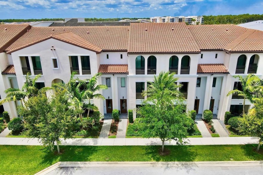 Beautiful 3-story Spanish-style townhome in the highly desirable Alton community of Palm Beach Gardens. First floor features a versatile den, walk-in closet, powder room, storage, and 2-car garage access. Second level offers open-concept living with modern kitchen, large island, quartz countertops, stainless steel appliances, Alabaster cabinetry, dining area, and great room opening to a covered balcony. Third floor includes a spacious primary suite with dual vanities, walk-in shower, private water closet, plus two bedrooms, full bath, and laundry. Resort-style amenities. Tenant occupied until May 15.