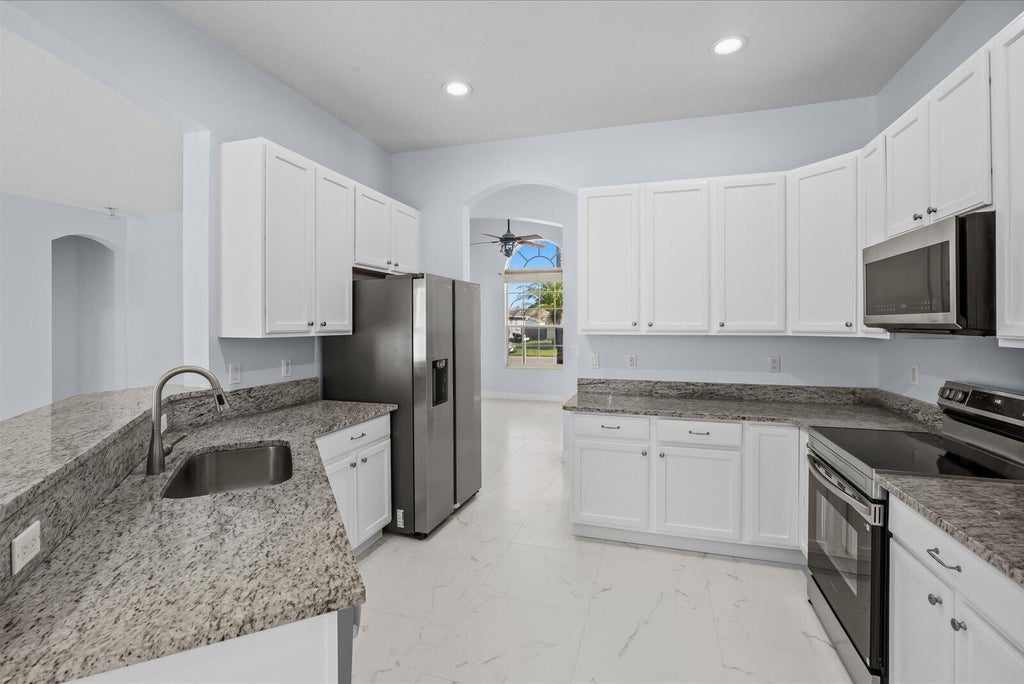 Photo of 1038 SW Fisherman Avenue, Port Saint Lucie, FL 34953 (MLS # B26068987)