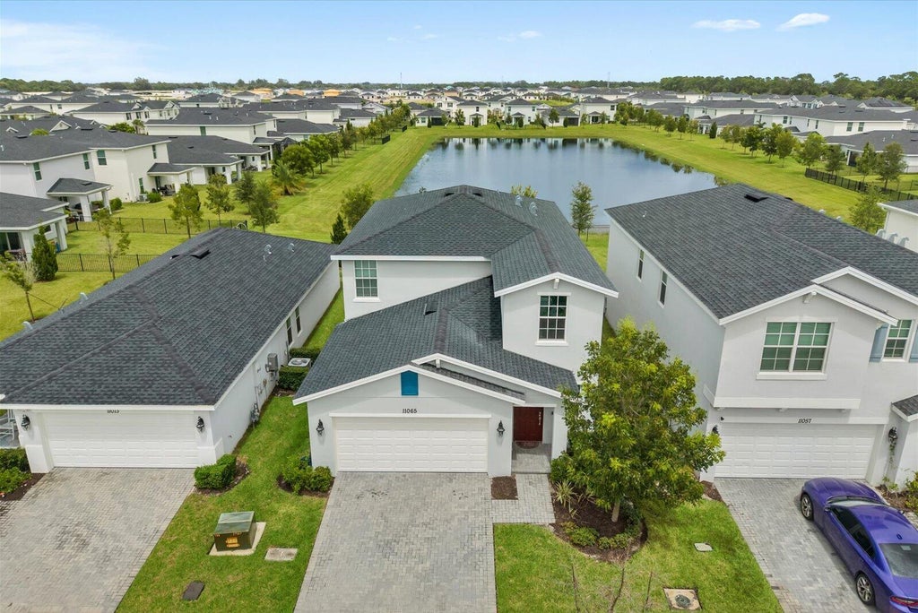 Photo of 11065 NW Pondside Lane, Port Saint Lucie, FL 34987 (MLS # B26076207)