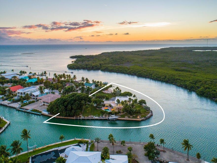 Rare Opportunity! Price adjustment of $1,095,000. Now offered at $6,900,000. Bring all offers! Stunning Tropical Compound! Enter the Private gates that open to this amazing Florida Keys Gem. One of a kind opportunity on 1.2 Acres of manicured grounds, palm trees and its own white sandy private beach. Yacht/Sport Fisherman's paradise with deep water dockage. 625+/- Feet of waterfront. Incredible sunrise and sunsets with a towering banyan tree. Minutes away from the best diving and fishing the Keys has to offer. 4 Bedroom 4.1 Baths, Chefs Kitchen, Open Floor Plan. Sip a cocktail at the outdoor bar and lounge at the pool. Roof top decks to gaze out at the stars and dine al fresco. Just minutes from The Marathon Airport. This Trophy Property is located in Sombrero Beach and