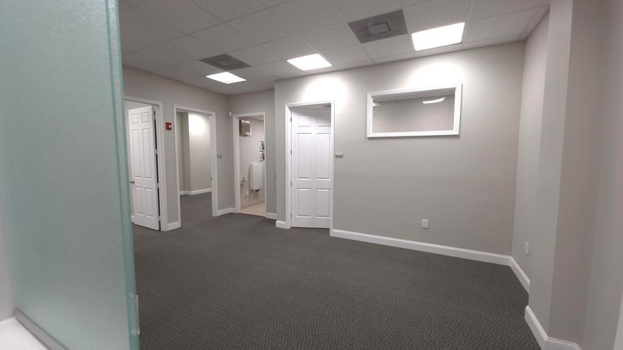 Stunning Executive office suite in Whispering Woods Commerce Center. Custom Office Fully Built Out. Elevate your business presence with this meticulously maintained ,rarely available first floor office suite. Spanning 932 sq ft  of functional high-end professional space. This unit is move in ready and designed for maximum efficiency and client impact ! Thoughtfully partitioned to accommodate a variety of professional services ,New Flooring, New Custom Doors, Freshly Painted ! There are 3  private offices Generously sized with ample natural lighting. A professional Reception area with a welcoming entryway designed to provide an exceptional first impression for your clients. Includes a private in-suite bathroom ensuring privacy & ease for staff and clients Great Coral Springs/Parkland Area !