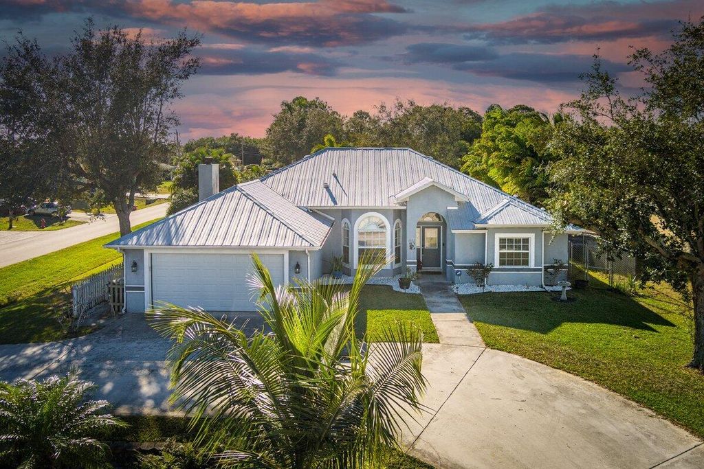 Photo of 1002 SW Hamrock Avenue, Port Saint Lucie, FL 34953 (MLS # R11154886)